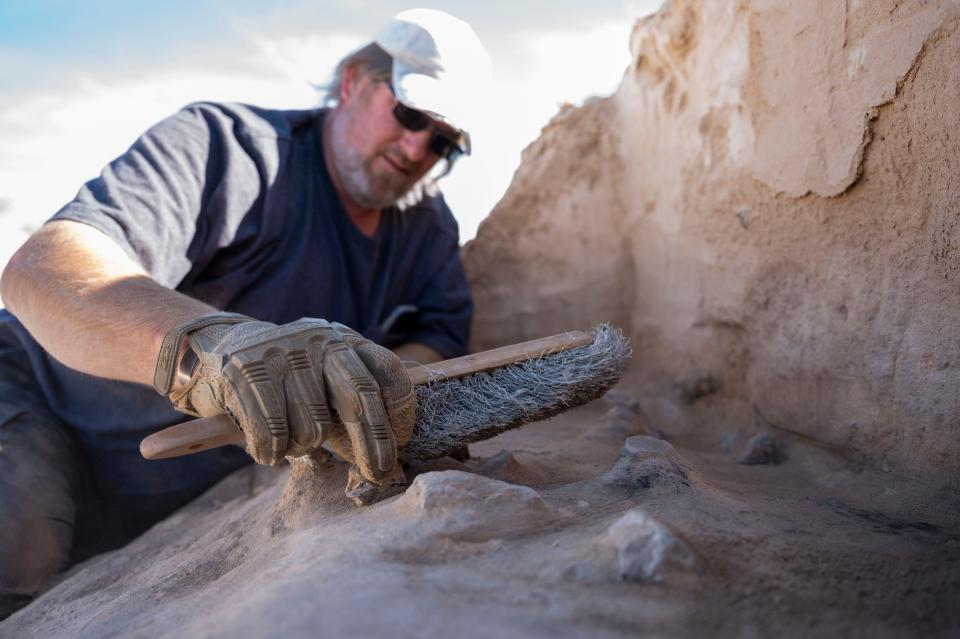 49th Civil Engineer Squadron cultural resource manager, Matthew Cuba brushes off the remnants of a Paleo-Archaic hearth named Gomolak Overlook at Holloman Air Force Base March 7, 2024. It is believed to be over 8,200 years old and one of the oldest in the Tularosa Basin.