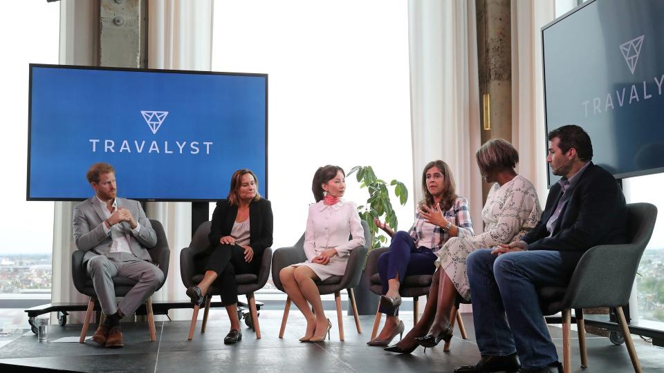 group of people talking on stage at launch event 