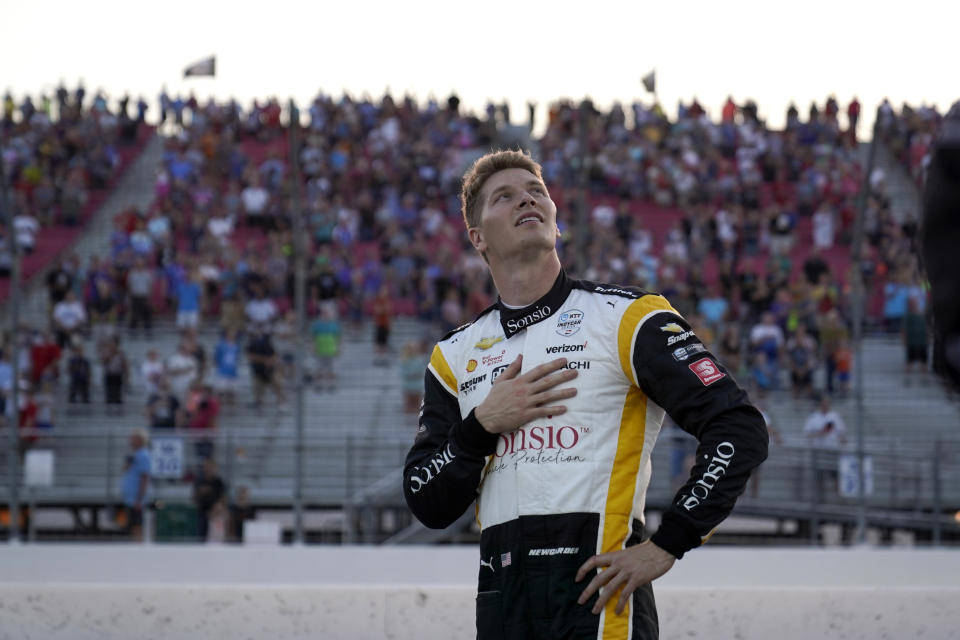 Josef Newgarden (2) looks up during the national anthem before the start an IndyCar auto race at World Wide Technology Raceway on Saturday, Aug. 21, 2021, in Madison, Ill. (AP Photo/Jeff Roberson)