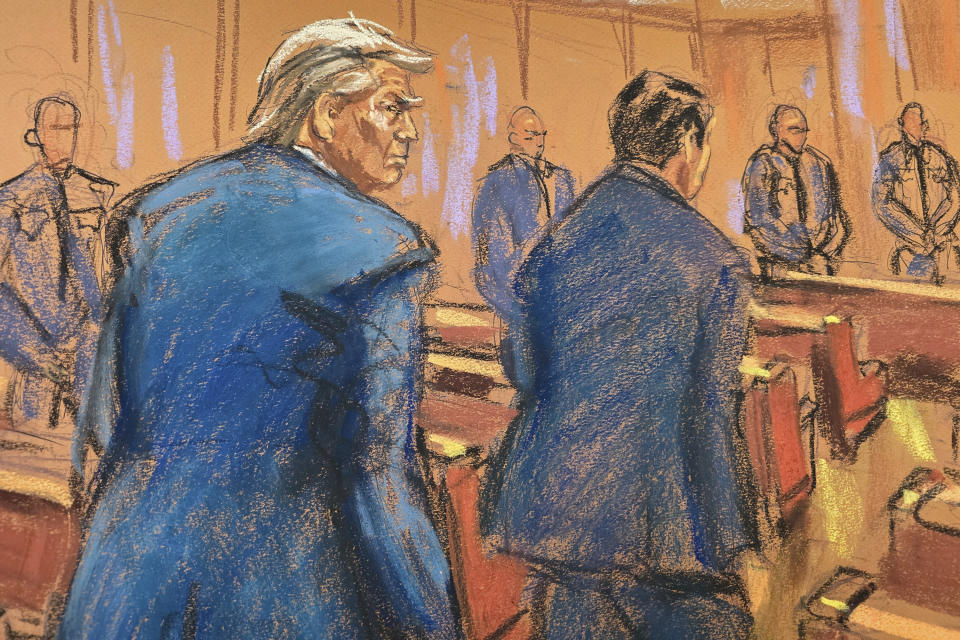 In this courtroom sketch former President Donald Trump enters the courtroom with his attorney Todd Blanche at the beginning of his trial over charges that he falsified business records to conceal money paid to silence porn star Stormy Daniels in 2016, in Manhattan state court in New York, Monday, April 15, 2024. (Jane Rosenberg/Pool Photo via AP)