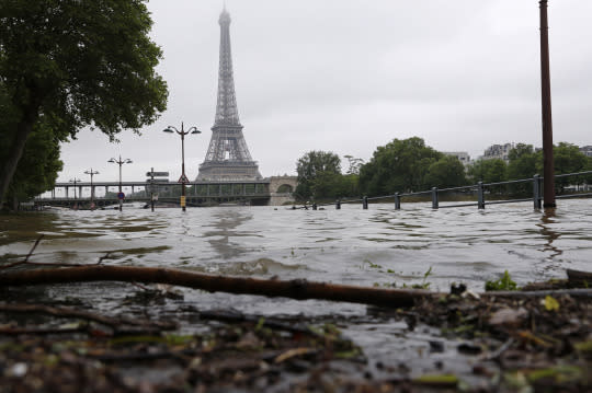 <p>View of the flooded river-side of the River Seine near the Eiffel tower in Paris, France, after days of almost non-stop rain caused flooding in the country, June 3, 2016. (REUTERS/Philippe Wojazer) </p>