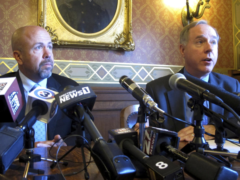 FILE - In this May 15, 2019 file photo, Wisconsin Republican Assembly Speaker Robin Vos, right, and Majority Leader Jim Steineke, left, speak in Madison, Wis. Wisconsin's Republican Assembly leaders are breaking with President Donald Trump over possibly delaying the Nov. 3, 2020 presidential election. Speaker Vos and Majority Leader Steineke tweeted Thursday, July 30, 2020, that they oppose delaying the election, a date that is enshrined in federal law and would require an act of Congress to change, including agreement from the Democratic-controlled House of Representatives. (AP Photo/Scott Bauer File)