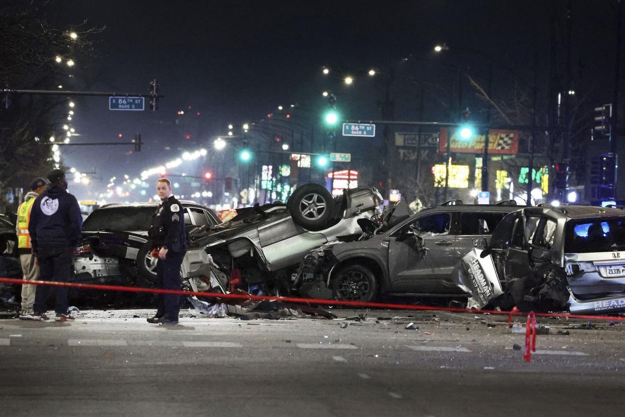 Chicago police process the double fatal crash scene at 87th Street and Cottage Grove Avenue in Chicago that sent 10 others to hospitals on Wednesday, Nov. 23, 2022.