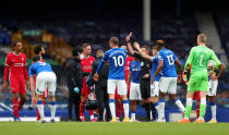 LIVERPOOL, ENGLAND - OCTOBER 17: Referee Michael Oliver shows a red card to Richarlison of Everton during the Premier League match between Everton and Liverpool at Goodison Park on October 17, 2020 in Liverpool, England. Sporting stadiums around the UK remain under strict restrictions due to the Coronavirus Pandemic as Government social distancing laws prohibit fans inside venues resulting in games being played behind closed doors. (Photo by Catherine Ivill/Getty Images)