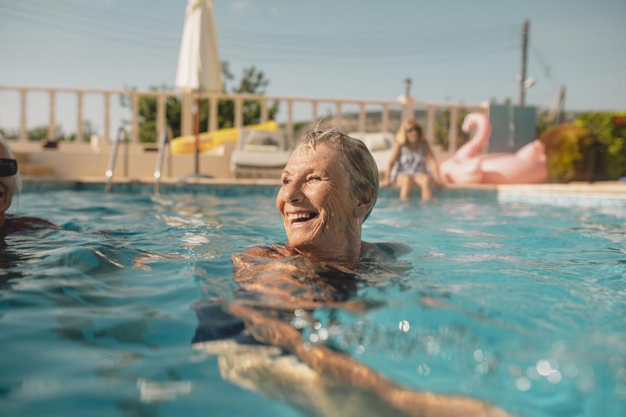 senior woman in pool enjoying water