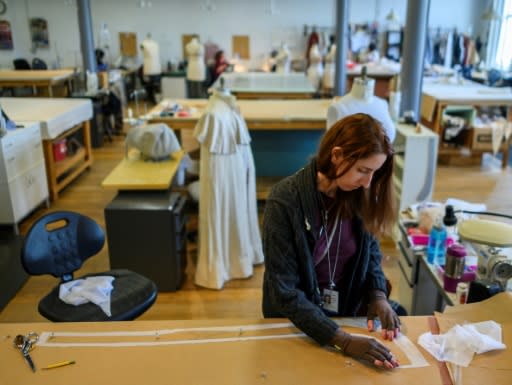 Staff spent eight weeks on fittings, alterations and new dresses for the period costumes, including Tosca's hand-printed mauve chiffon gown in Act I; 16 people worked on the costumes, with new dresses for Alkema and substitute soprano Latonia Moore