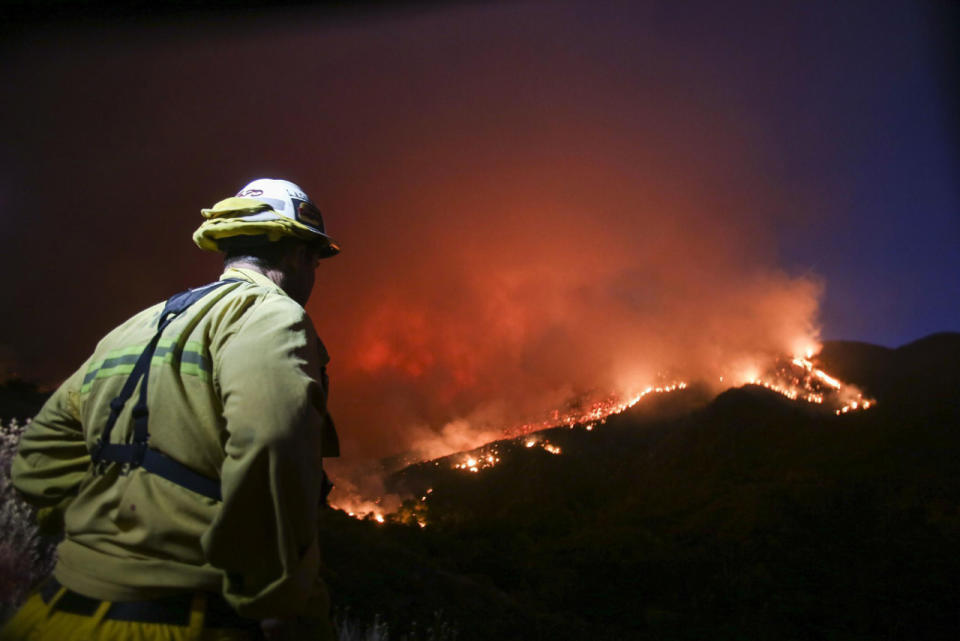 <p>A firefighter watches a wildfire near Placenta Canyon Road in Santa Clarita, Calif., July 24, 2016. (AP Photo/Ringo H.W. Chiu)</p>