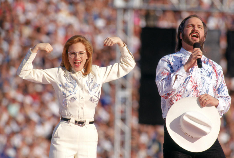 Country music star Garth Brooks sings the National Anthem with American sign language translation performed by actress Marlee Matlin prior to Super Bowl XXVII between the Dallas Cowboys and the Buffalo Bills at the Rose Bowl on January 31, 1993 in Pasadena, California. The Cowboys defeated the Bills 52-17.&nbsp;