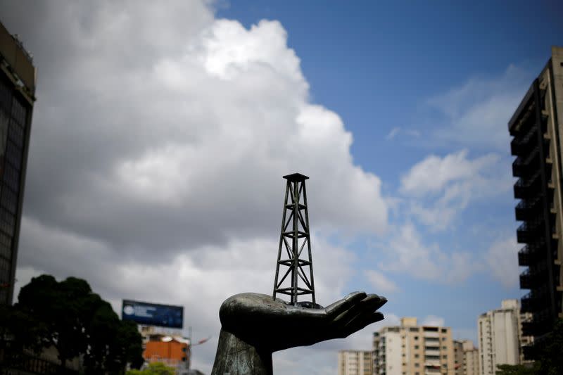 FILE PHOTO: A sculpture is seen outside a building of Venezuela's state oil company PDVSA in Caracas