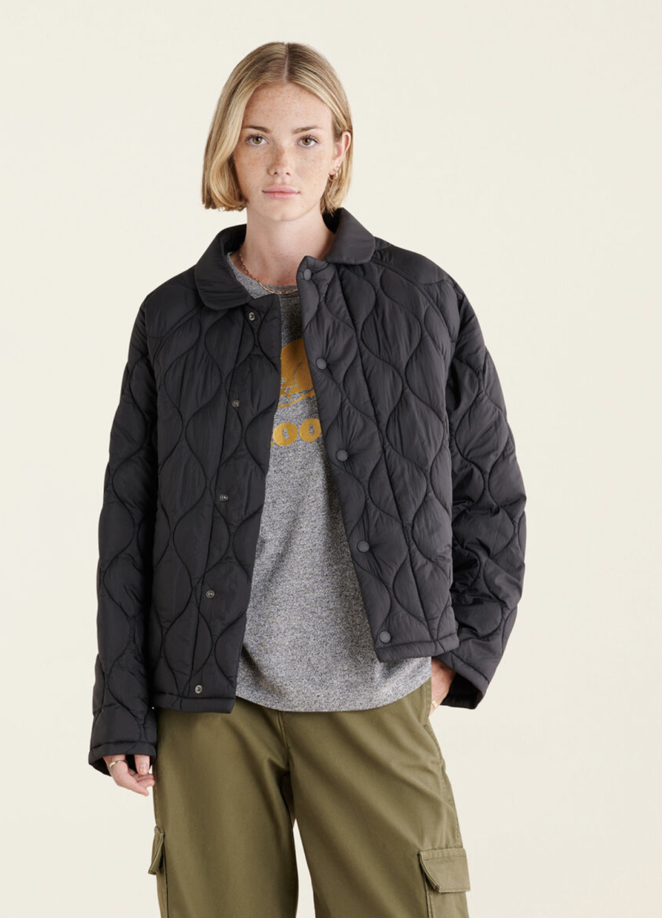 model model wearing green pants and Brooks Quilted Jacket in Black (Photo via Roots)