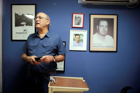 Journalist Carlos Fernando Chamorro, a critic of the government of President Daniel Ortega, speaks to the press after his office was raided Thursday night by the national police in Managua, Nicaragua December 14, 2018. REUTERS/Oswaldo Rivas