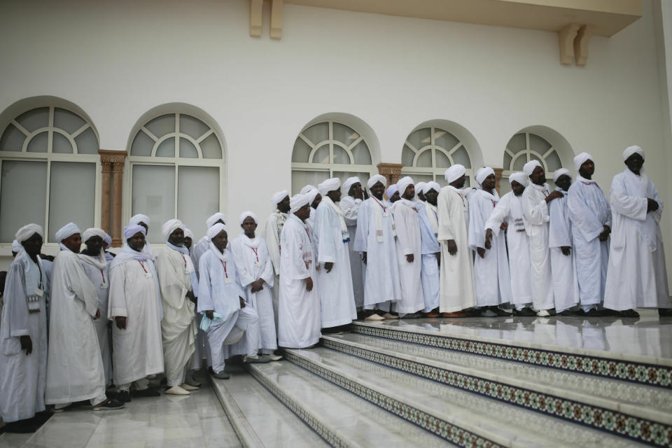 Religious students wait for Pope Francis to arrive at the Mohammed VI Institute, a school of learning for imams, in Rabat, Morocco, Saturday, March 30, 2019. Francis's weekend trip to Morocco aims to highlight the North African nation's tradition of Christian-Muslim ties while also letting him show solidarity with migrants at Europe's door and tend to a tiny Catholic flock on the peripheries. (AP Photo/Mosa'ab Elshamy)