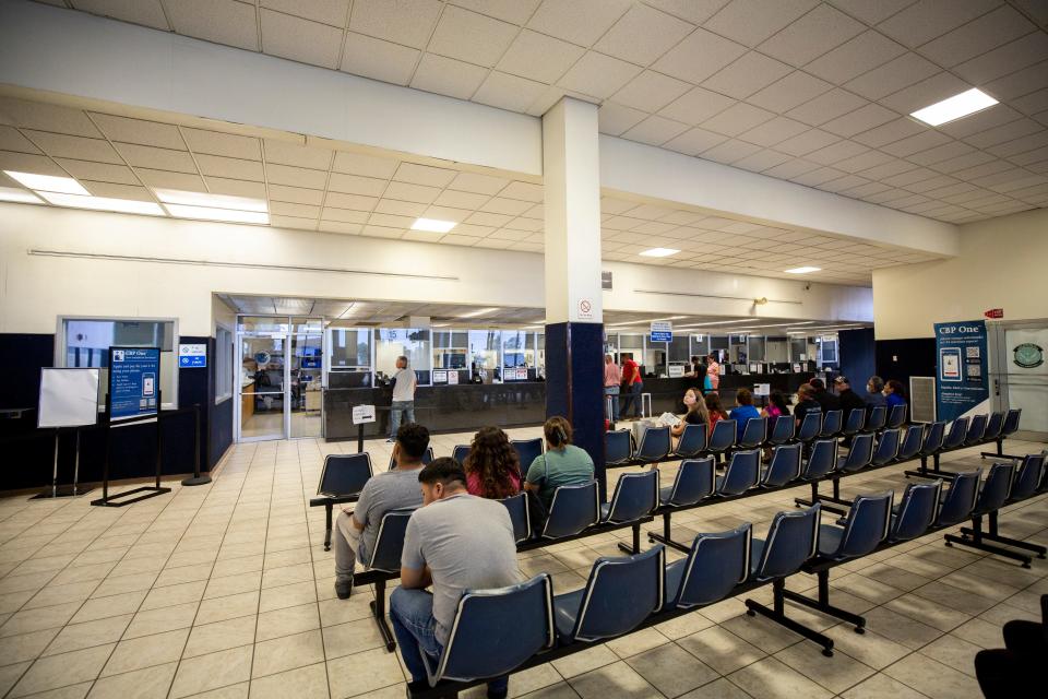 U.S. visa holders wait in a processing room to acquire traveling permits at the Bridge of the Americas port of entry. The 50-year-old land port of entry administrative building shows signs of age in its infrastructure.