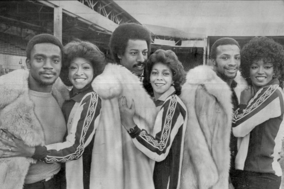 Cunningham, Batson and Regis (right) pose for a photograph alongside Motown band, the Three Degrees, at the Hawthorns Photo: Rex Features