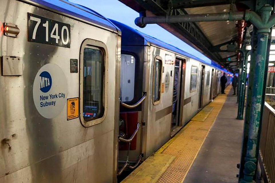 PHOTO: New York Police walk through the Mount Eden subway station while investigating a shooting on the platform, Feb. 12, 2024, in the Bronx borough of New York.  (New York Police Department via AP)