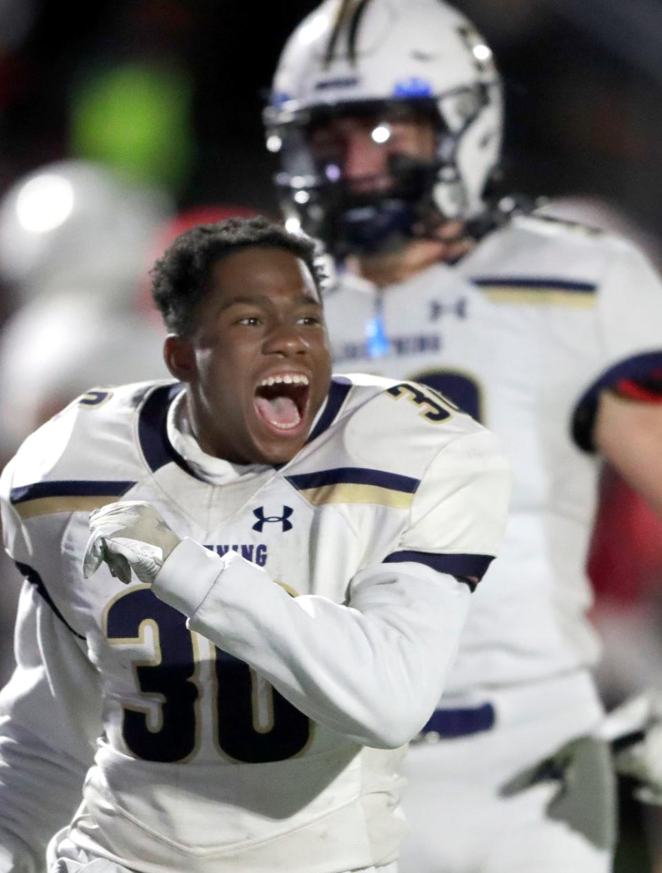 Appleton North's Duke Connors (30) celebrates the team's victory over Kimberly during their WIAA Division 1 state quarterfinal football game Friday in Kimberly. North defeated Kimberly 21-10.