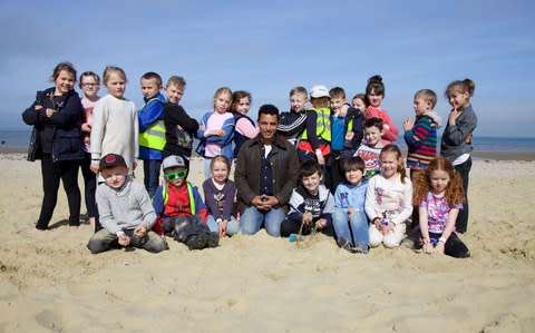 Dr Javid Abdelmoneim with the kids on a school outing to the beach - Credit:  Outline Productions/2