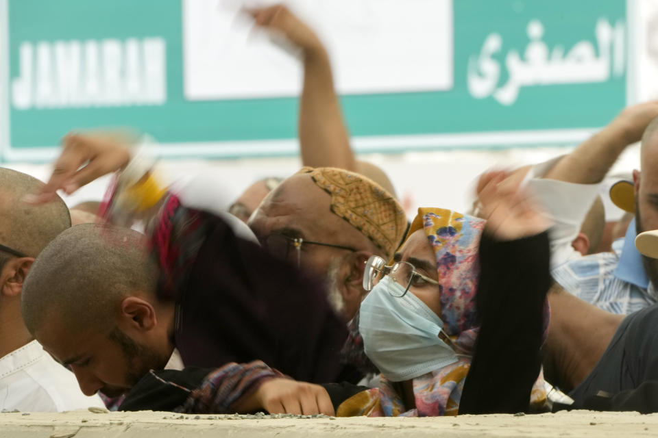 Muslim pilgrims cast stones at pillars in the symbolic stoning of the devil, the last rite of the annual Hajj, in Mina near the holy city of Mecca, Saudi Arabia, Friday, June 30, 2023. (AP Photo/Amr Nabil)