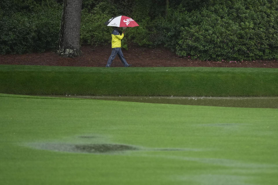Hideki Matsuyama, of Japan, walks on the 12th hole during the weather delayed third round of the Masters golf tournament at Augusta National Golf Club on Saturday, April 8, 2023, in Augusta, Ga. (AP Photo/Matt Slocum)