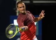 Jul 26, 2016; Toronto, Ontario, Canada; Mikhail Youzhny of Russia hits a shot against Stan Wawrinka of Switzerland on day two of the Rogers Cup tennis tournament at Aviva Centre. Mandatory Credit: Dan Hamilton-USA TODAY Sports