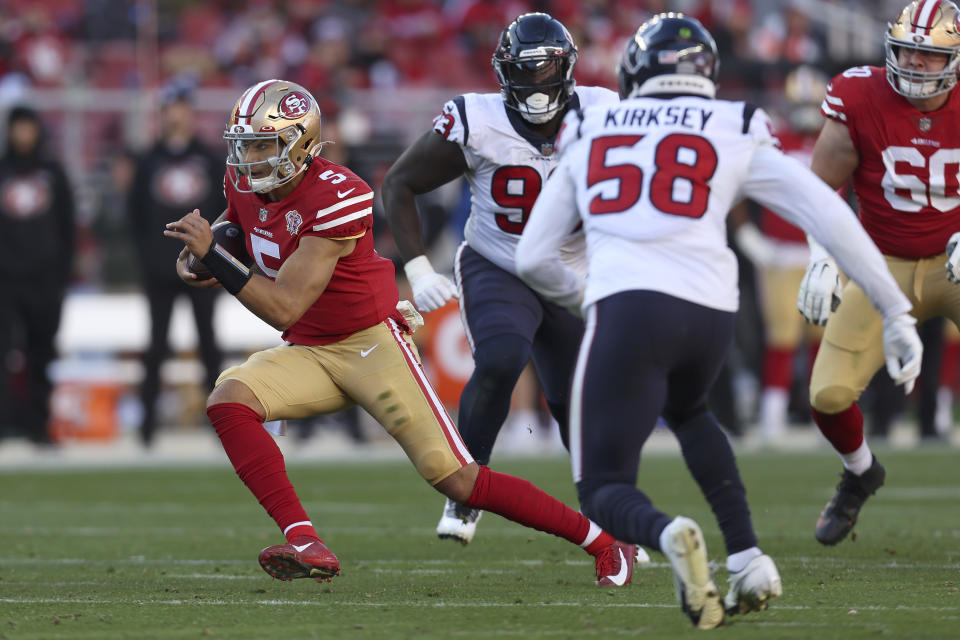 San Francisco 49ers quarterback Trey Lance (5) runs against Houston Texans middle linebacker Christian Kirksey (58) during the second half of an NFL football game in Santa Clara, Calif., Sunday, Jan. 2, 2022. (AP Photo/Jed Jacobsohn)