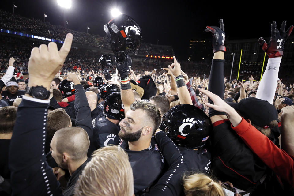 CINCINNATI, OH - OCTOBER 04: Cincinnati Bearcats players and fans celebrate after the game against the Central Florida Knights at Nippert Stadium on October 4, 2019 in Cincinnati, Ohio. Cincinnati defeated Central Florida 27-24. (Photo by Joe Robbins/Getty Images)