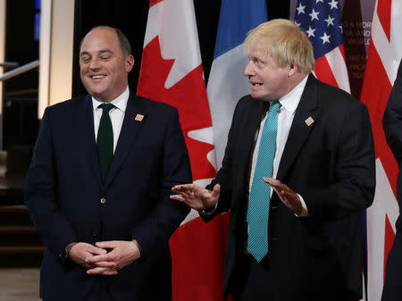 Britain's Foreign Secretary Boris Johnson and British Security Minister Ben Wallace wait for a group photo to take place on the second day of meetings for foreign ministers from G7 countries in Toronto, Ontario, Canada April 23, 2018. REUTERS/Fred Thornhill