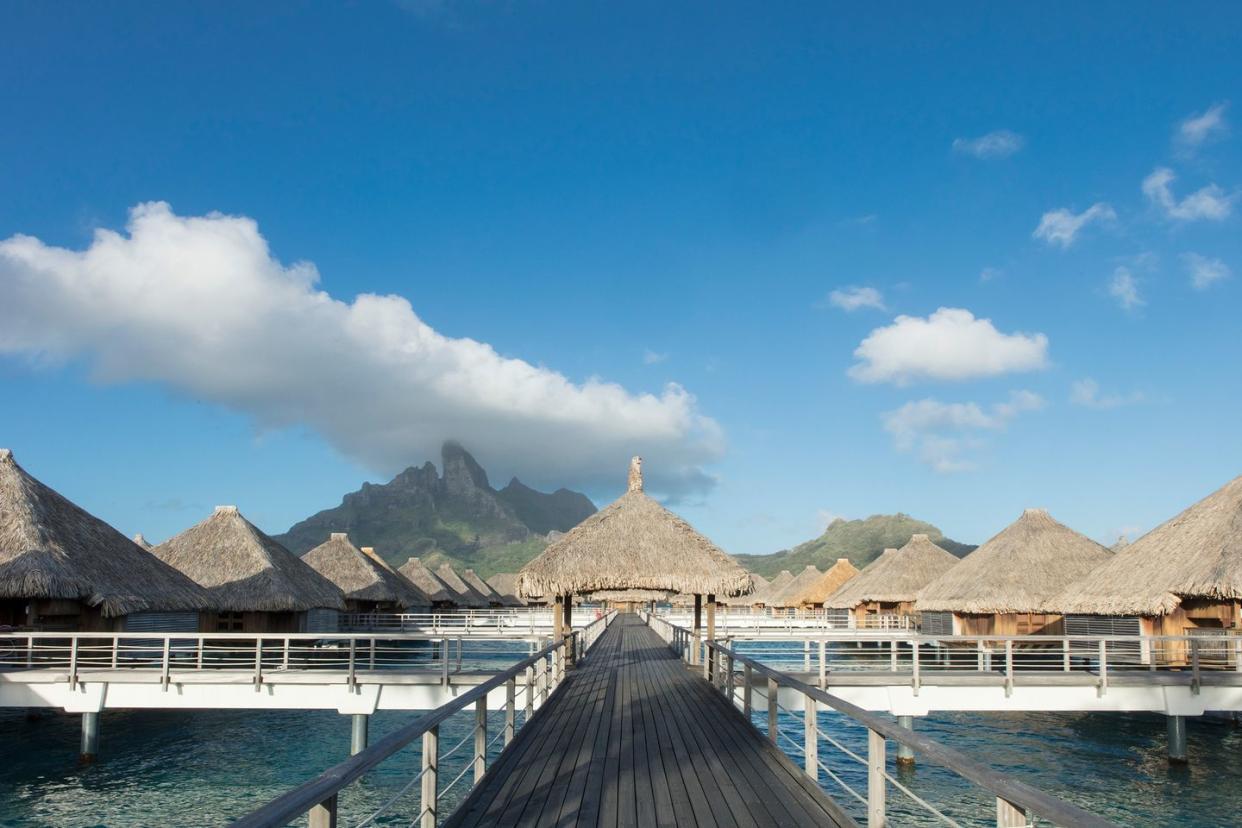 a group of buildings next to a body of water