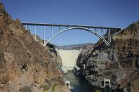 A survey image of the Hoover Dam and Mike O'Callaghan-Pat Tillman Memorial Bridge from the heliport in Boulder City, Nev. The structure is dedicated to the memories of former Arizona Cardinal Pat Tillman and former Nevada Governer Mike O'Callaghan (AP Photo/Pablo Martinez Monsivais)