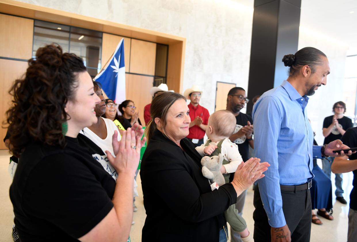 Members of the Freedom Act Lubbock movement deliver petition signatures to the Lubbock city secretary, Tuesday, Oct. 17, 2023, at Citizens Tower.