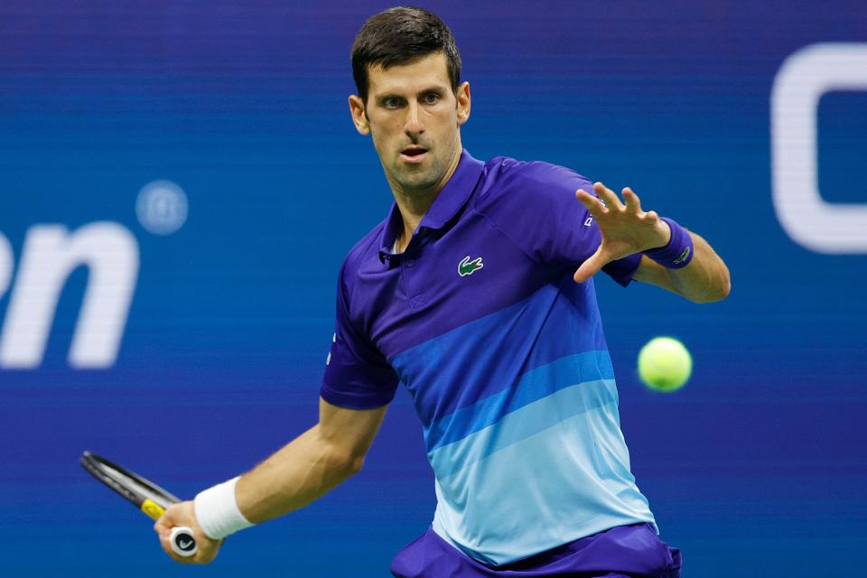 Novak Djokovic returns the ball against Holger Vitus Nodskov Rune of Denmark on Day Two of the 2021 US Open at the Billie Jean King National Tennis Center on August 31, 2021 New York City.