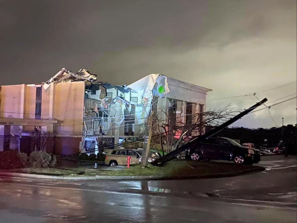 <p>A Hampton Inn hotel is severely damaged after a tornado tore through Fultondale, Alabama, on Monday 25 January 2021</p> ((Associated Press))