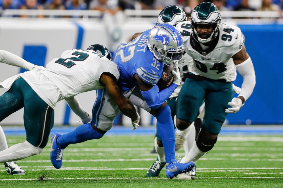 Lions running back D'Andre Swift runs against Eagles cornerback Darius Slay during the first half on Sunday, Sept. 11, 2022, at Ford Field.