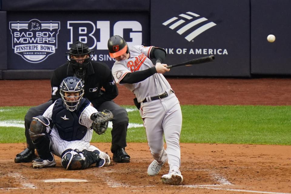 Baltimore Orioles' Austin Hays, right, hits a double during the sixth inning of a baseball game against the New York Yankees, Sunday, Oct. 2, 2022, in New York. (AP Photo/Frank Franklin II)