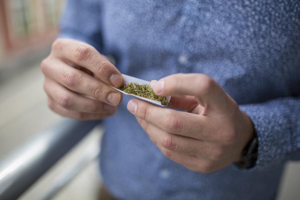 Man Rolling a Marijuana joint