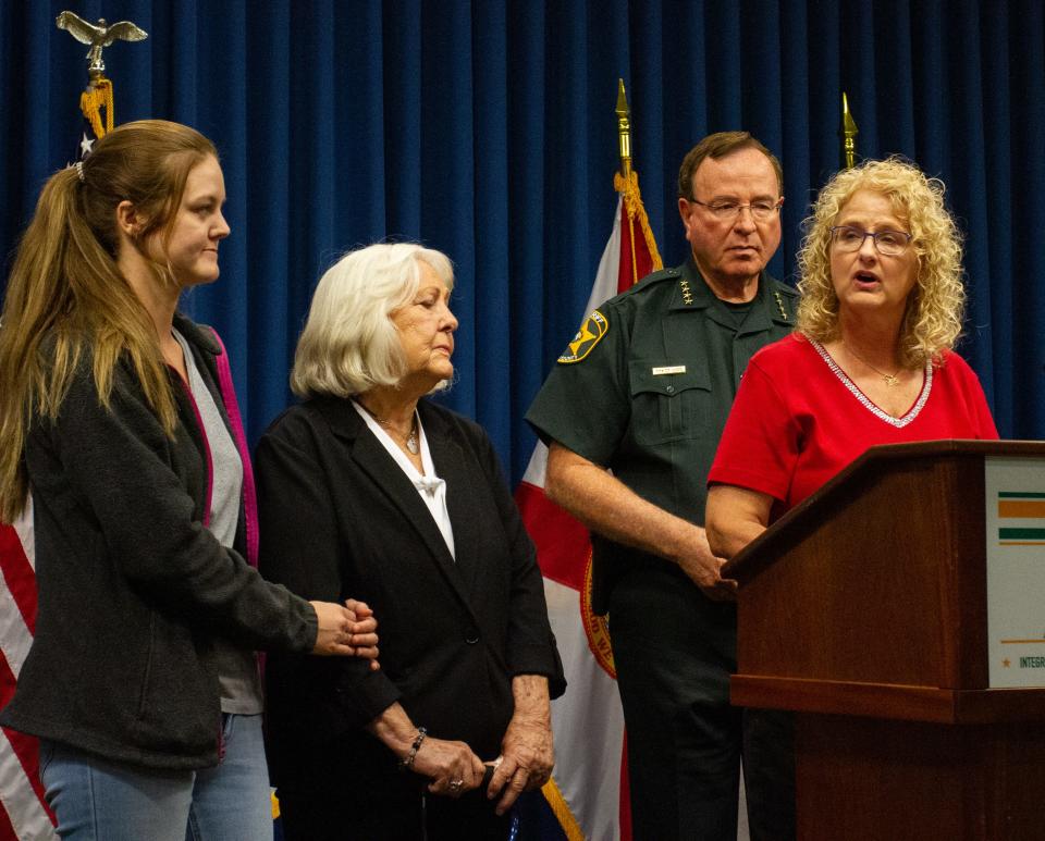 Pam Shade, the sister of Teresa Scalf, stands with her mother, Betty Scalf, and Teresa's granddaughter, Teresa Wouters, at a news conference Monday.