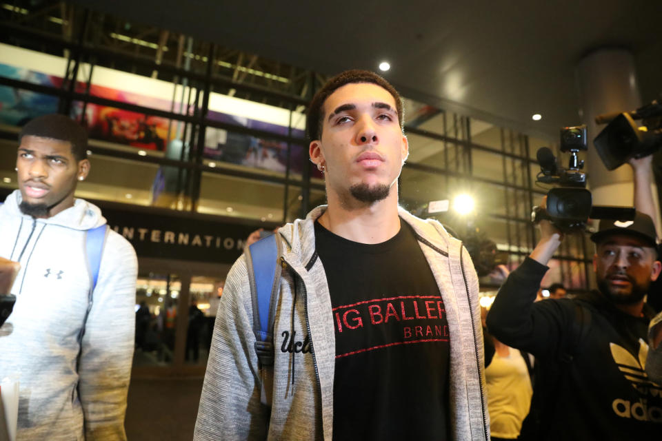 UCLA basketball player LiAngelo Ball is seen arriving in Los Angeles on Tuesday after being detained in China on suspicion of shoplifting.&nbsp; (Photo: Lucy Nicholson / Reuters)