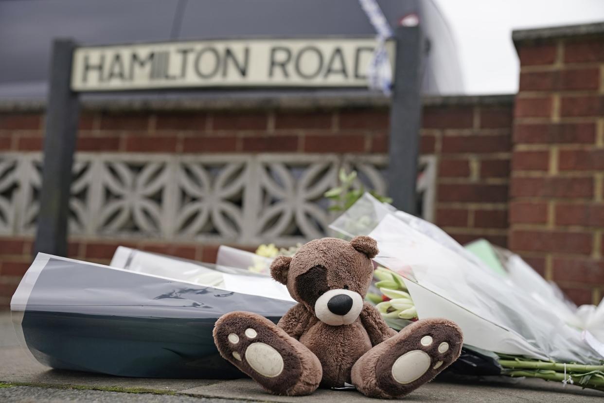 A teddy bear left at the scene of a house fire where two children and two women died on Thursday evening (PA)