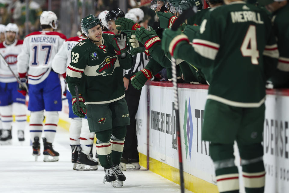 Minnesota Wild center Marco Rossi (23) is congratulated after his power play goal against the Montreal Canadiens during the first period of an NHL hockey game Thursday, Dec. 21, 2023, in St Paul, Minn. (AP Photo/Matt Krohn)