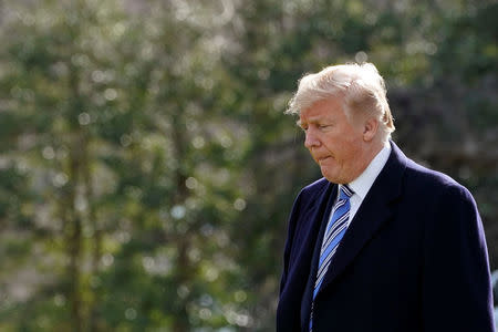 U.S. President Donald Trump walks on South Lawn of the White House in Washington, U.S., before his departure for the weekend in Palm Beach, Florida, March 23, 2018. REUTERS/Yuri Gripas