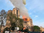 A large security perimeter was set up by firefighters after they evacuated the cathedral. The first units to arrive on the scene included four large ladders and two aerial lift arms. Pedestrians flooded the streets to watch and document the blaze, many in tears, one Paris resident tells PEOPLE. 