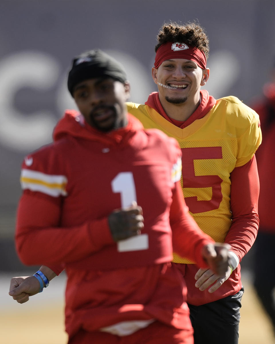 Kansas City Chiefs quarterback Patrick Mahomes, right, and running back Jerick McKinnon (1) stretch during practice Wednesday, Feb. 7, 2024 in Henderson, Nev. The Chiefs are scheduled to play the San Francisco 49ers in the NFL's Super Bowl 58 football game Sunday in Las Vegas. (AP Photo/Charlie Riedel)