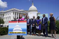 Rep. Kathy Castor, D-Fla., left, speaks about the climate crisis and the Inflation Reduction Act during a news conference on Capitol Hill in Washington, Friday, Aug. 12, 2022. (AP Photo/Susan Walsh)