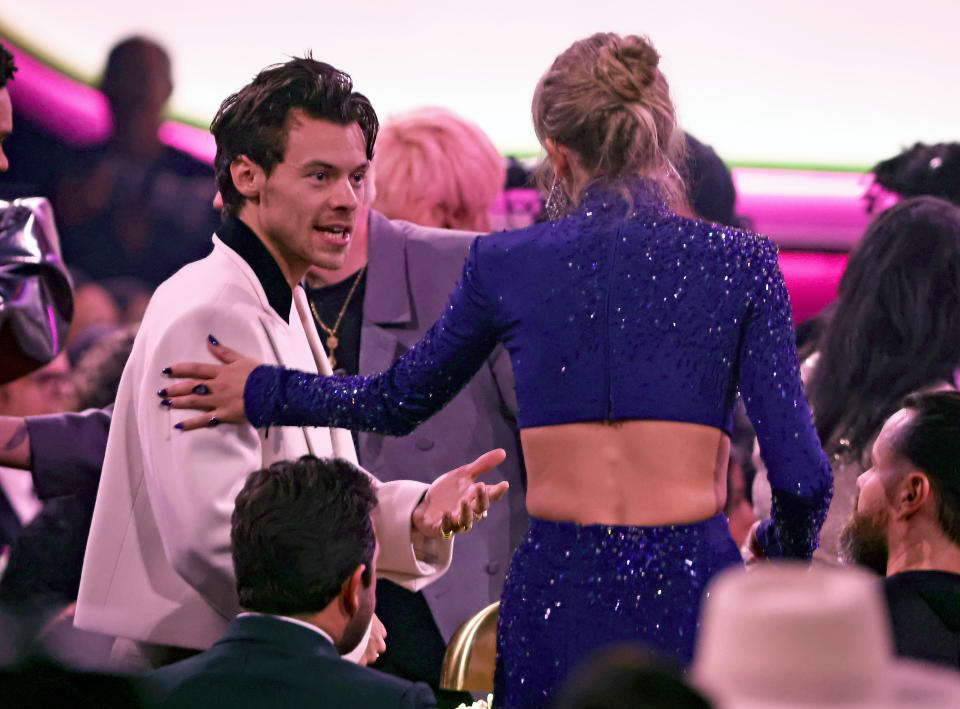 LOS ANGELES, CALIFORNIA - FEBRUARY 05: (FOR EDITORIAL USE ONLY) (L-R) Harry Styles and Taylor Swift speak during the 65th GRAMMY Awards at Crypto.com Arena on February 05, 2023 in Los Angeles, California. (Photo by Frazer Harrison/Getty Images)