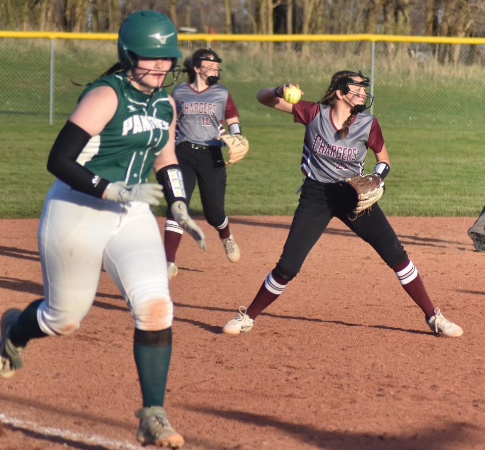 Union City's Grace Phelps looks to first for an out versus Pennfield on Tuesday