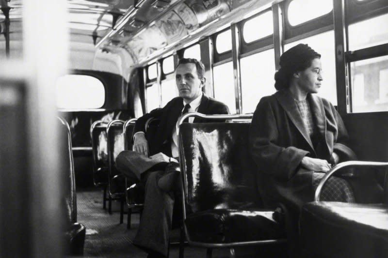 Rosa Parks sits up front of a Montgomery, Ala., bus, posed with UPI reporter Nicholas Chriss on December 21,1956, one year after she refused to give up her seat to a white man and was arrested on December 1, 1955. File Photo by UPI