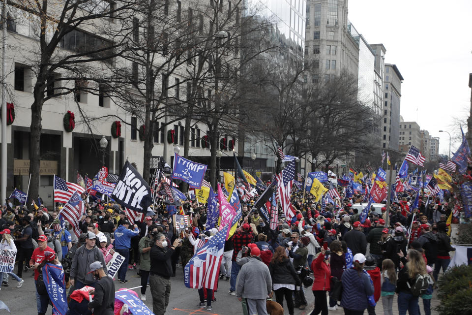 Supporters of President Donald Trump attend a rally at Freedom Plaza, Saturday, Dec. 12, 2020, in Washington. (AP Photo/Luis M. Alvarez)