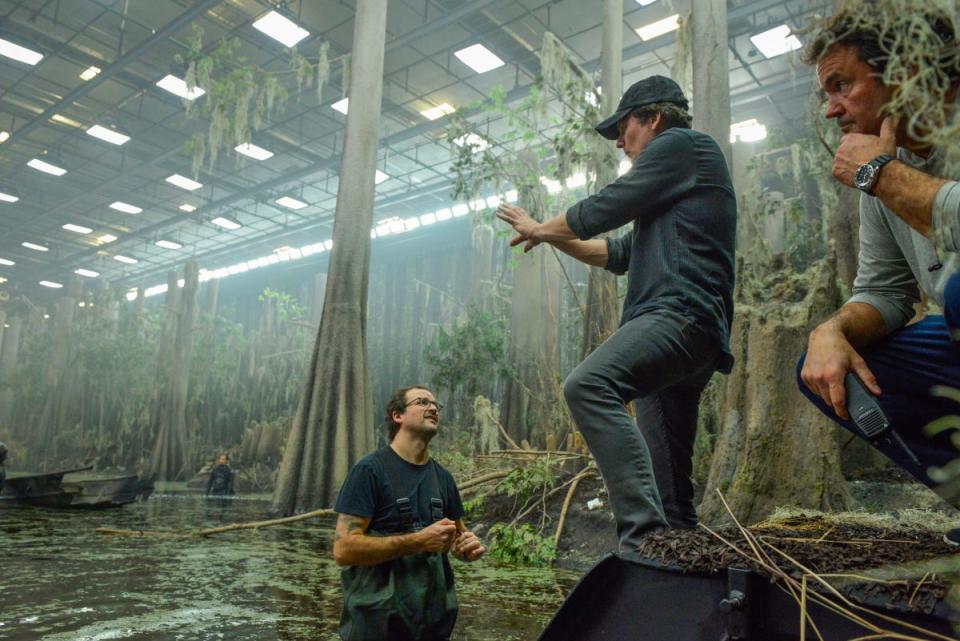 Director and executive producer Len Wiseman (center) sets up a scene during the pilot episode of "Swamp Thing" on the expansive swamp set at EUE/Screen Gems Studios in Wilmington, 2018.