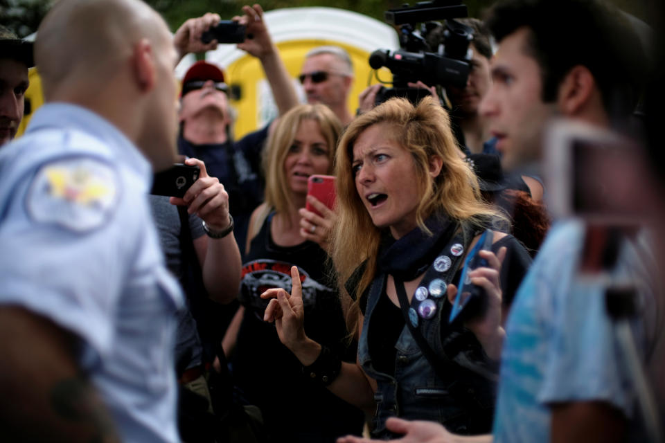 <p>Counter-demonstrator Lacy MacAuley of Washington confronts attendees at the Mother of All Rallies as police officers step in, on the National Mall in Washington, Sept. 16, 2017. (Photo: James Lawler Duggan/Reuters) </p>