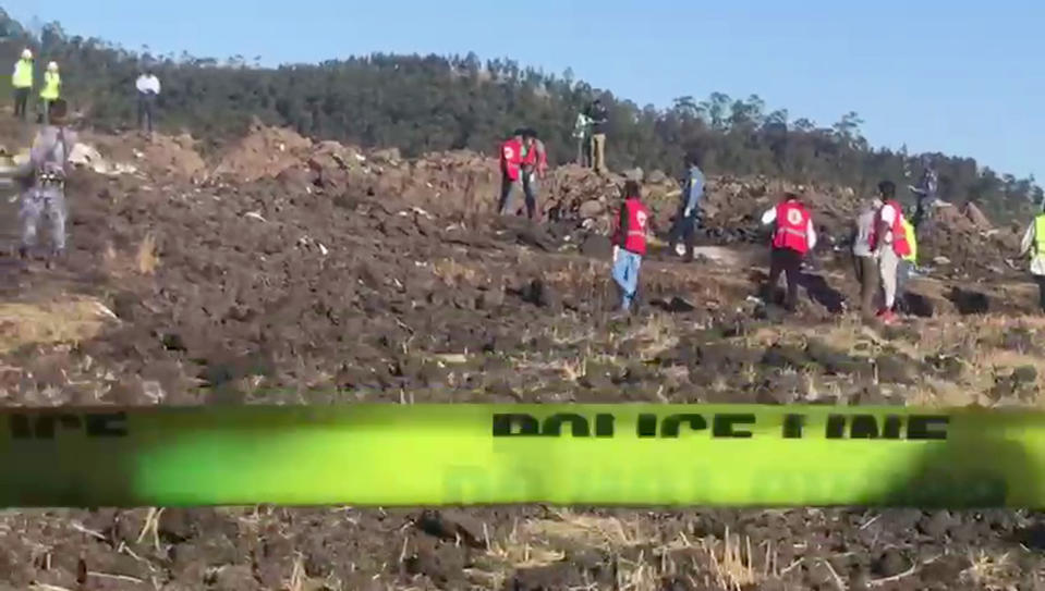 In this image taken from video, rescuers search through wreckage at the scene of an Ethiopian Airlines flight that crashed shortly after takeoff at Hejere near Bishoftu, or Debre Zeit, some 50 kilometers (31 miles) south of Addis Ababa, in Ethiopia, March 10, 2019. (Photo: Yidnek Kirubel/AP)